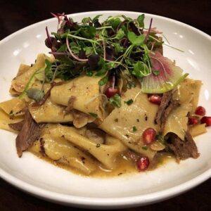 Fresh Papardelle with duck confit, pomegranate and radish by 5Church Atlanta